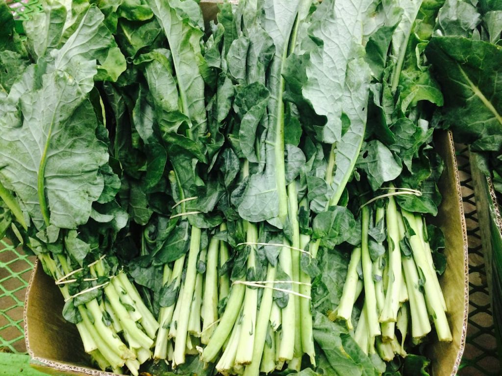 green-leafy-vegetables-2095569 Vibrant fresh green leafy vegetables on display, showcasing organic produce.