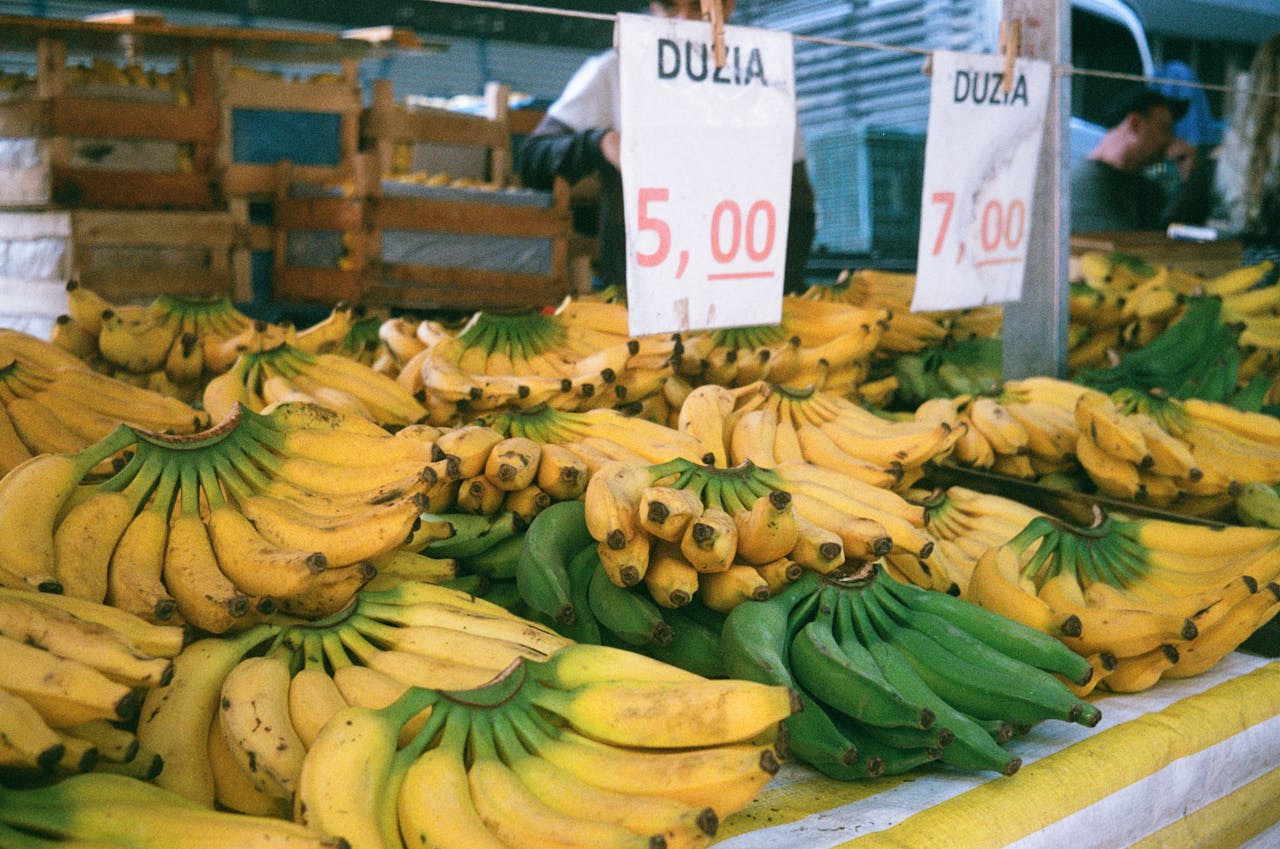 Colorful display of bananas at an outdoor market in São Paulo, Brazil.